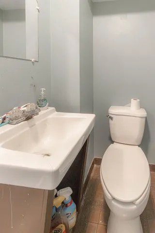 a bathroom with a toilet and a sink