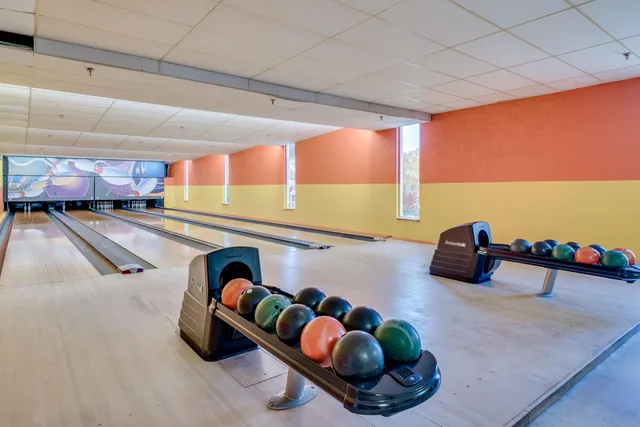 a room with lots of gym equipment
