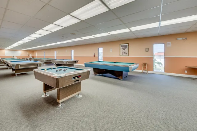 a kitchen with a stove and a refrigerator