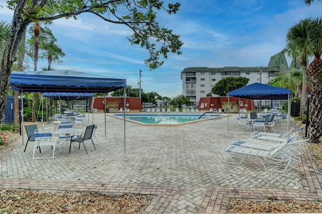 a view of a swimming pool with a yard