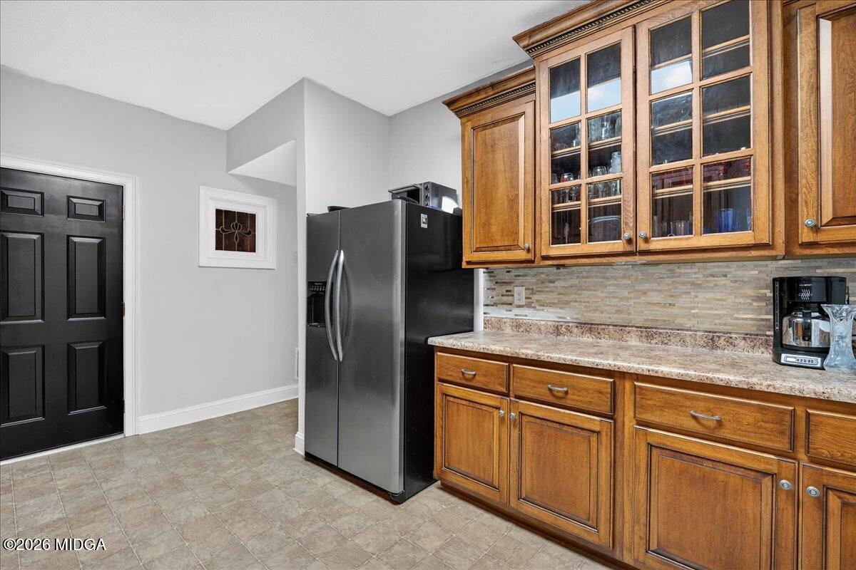 518 River Overlook Forsyth, GA 31029 - Photo 50 of 96 a kitchen with stainless steel appliances granite countertop a refrigerator and a sink