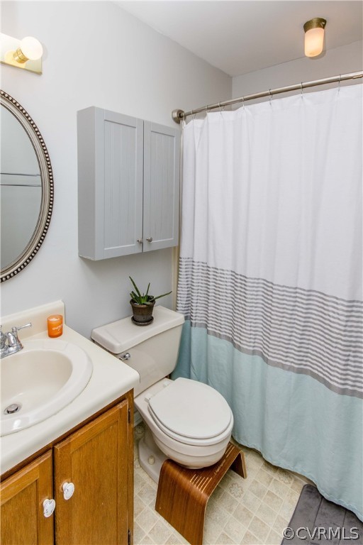 5512 Gatebridge Road North Chesterfield, VA 23234 - Photo 18 of 23 a bathroom with a toilet a sink and a shower curtain