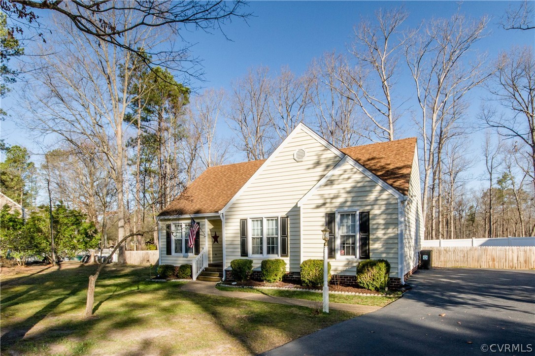5512 Gatebridge Road North Chesterfield, VA 23234 - Photo 23 of 23 a view of a white house with a yard patio and fire pit