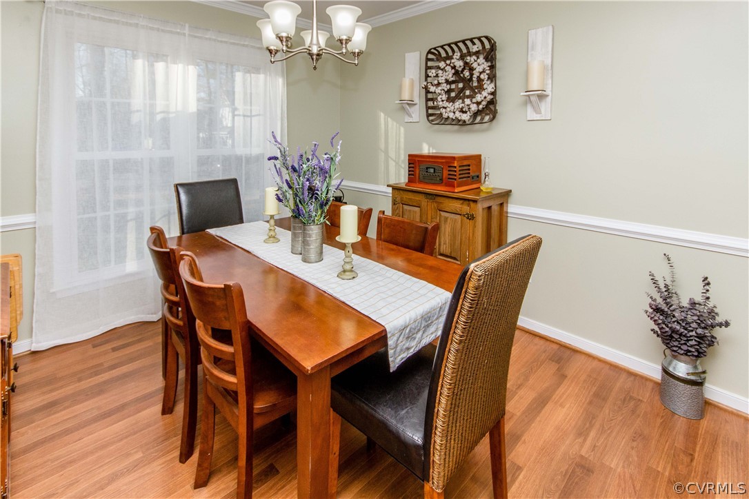 5512 Gatebridge Road North Chesterfield, VA 23234 - Photo 9 of 23 a view of a dining room with furniture and wooden floor