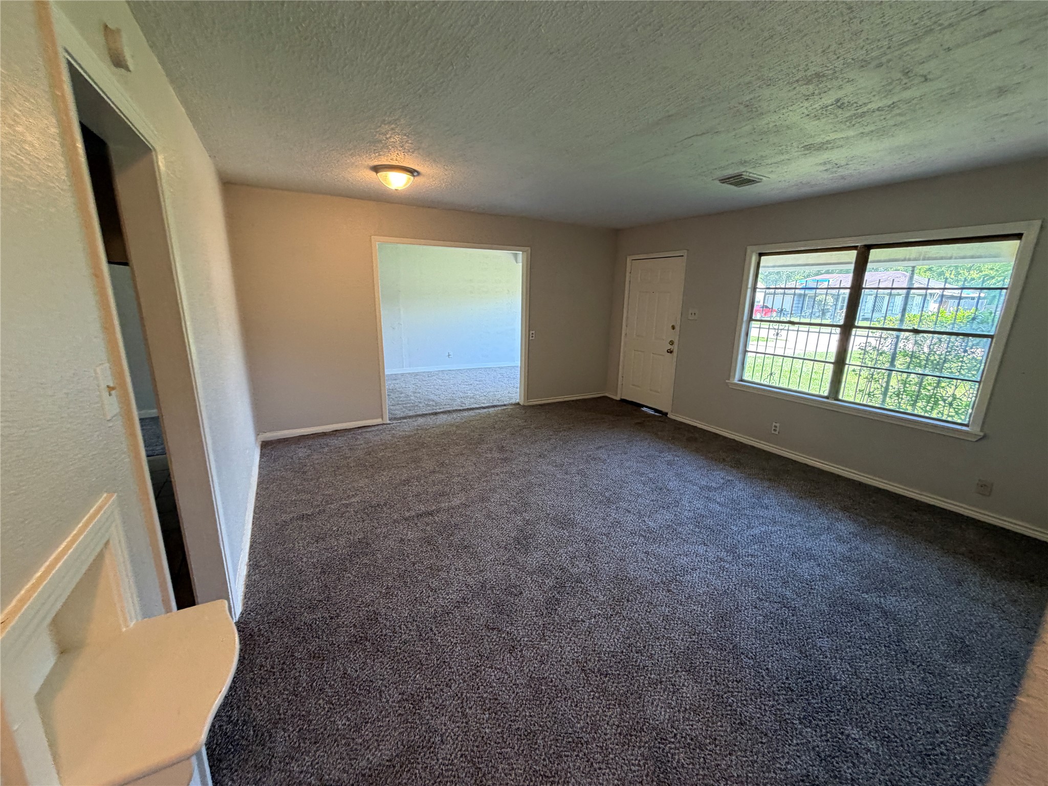 3614 Cosby Street Houston, TX 77021 - Photo 3 of 16 a view of an empty room with a window