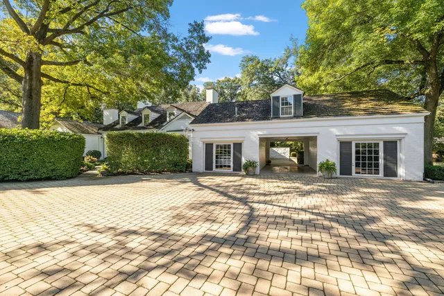 a view of a backyard with large trees