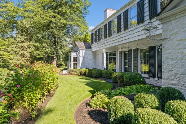 an aerial view of house with yard and outdoor seating