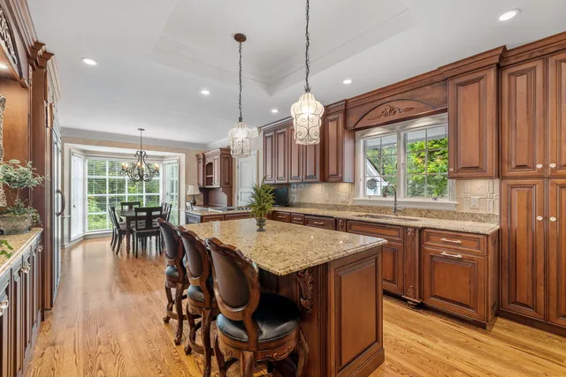 a kitchen with a stove sink and cabinets