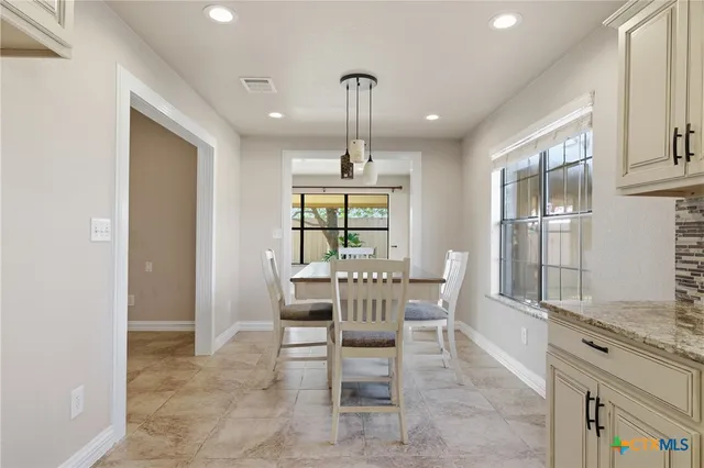 a dining room well furnished