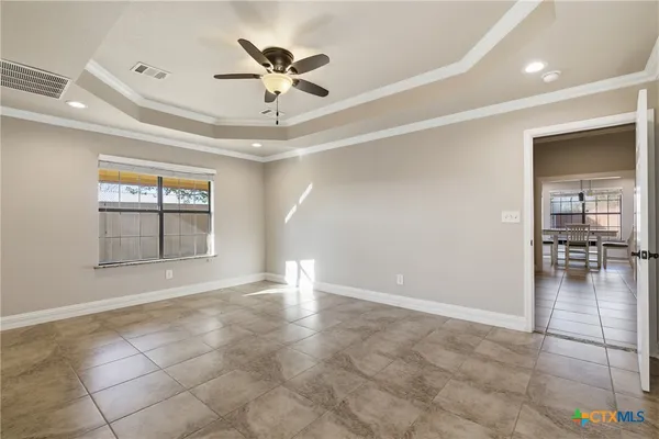 a view of an empty room with a window