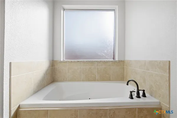 a bathroom with a bathtub