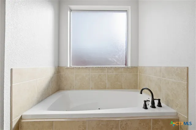 a bathroom with a bathtub