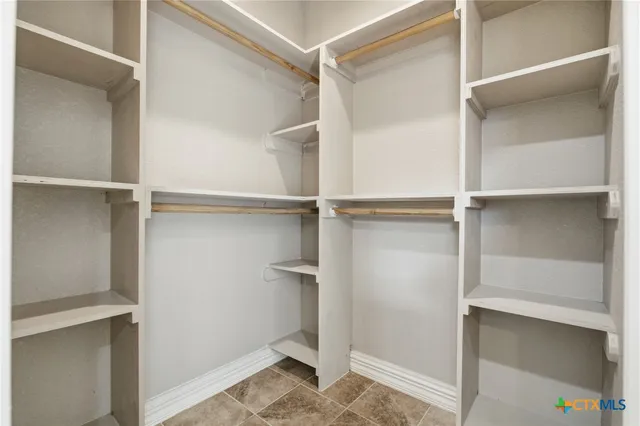 a view of an empty walk in closet