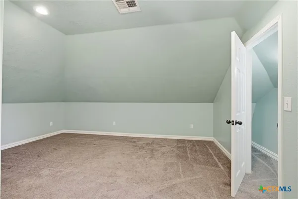 an empty room with a bathtub