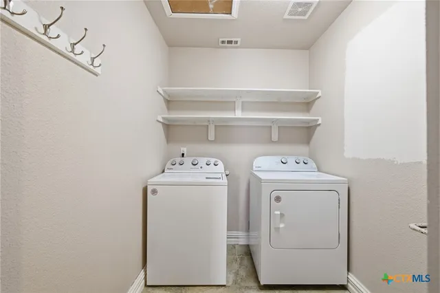 a utility room with dryer and washer