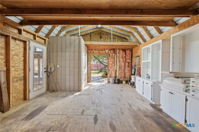 a picture of door with a white wall