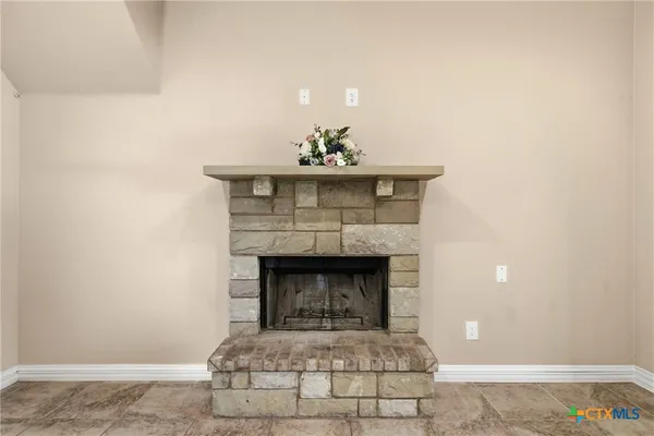 a living room with a fireplace
