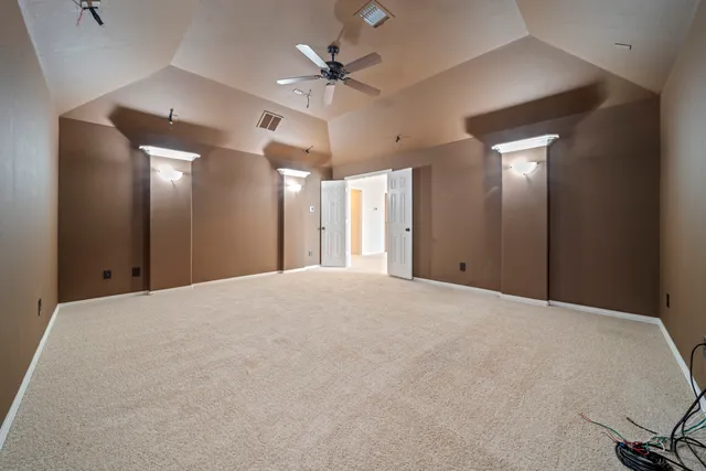a view of a livingroom with a chandelier fan