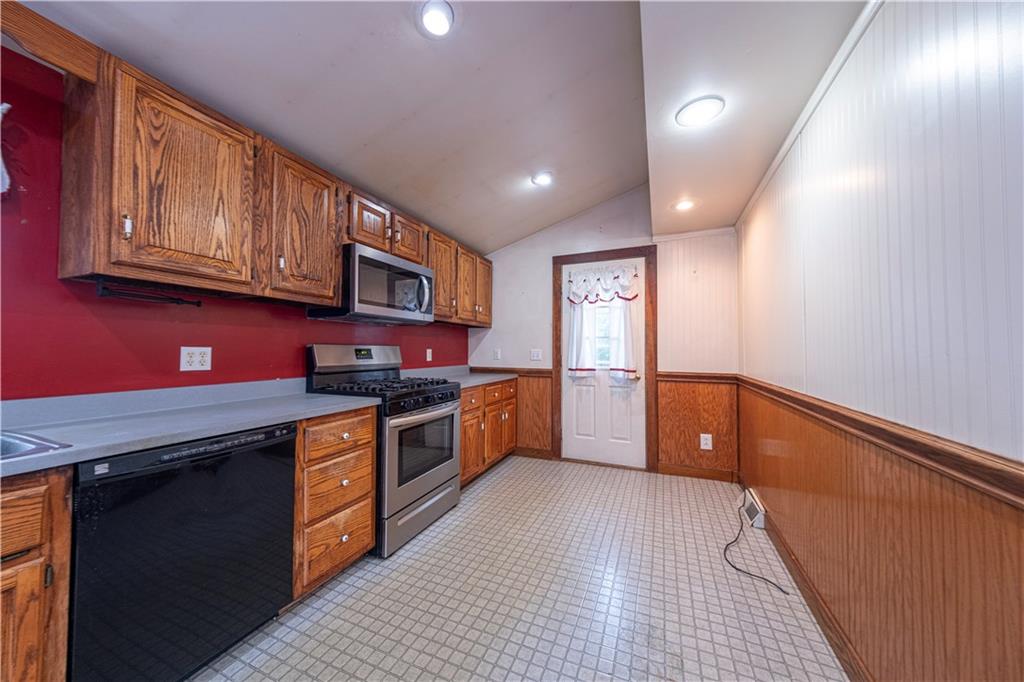 1645 Brown Road Ellwood City, PA 16117 - Photo 13 of 35 a kitchen with stainless steel appliances granite countertop wooden cabinets a sink and dishwasher