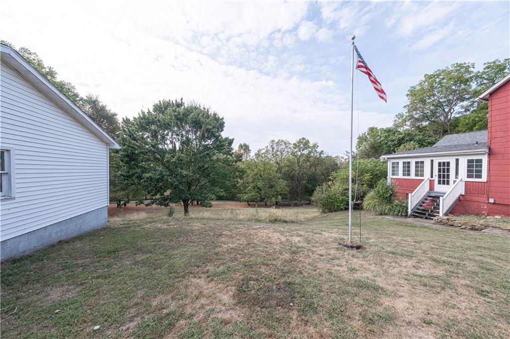 1645 Brown Road Ellwood City, PA 16117 - Photo 25 of 35 a view of a house with a backyard and trees