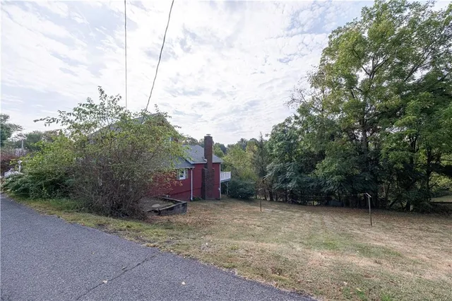 an aerial view of residential house with outdoor space