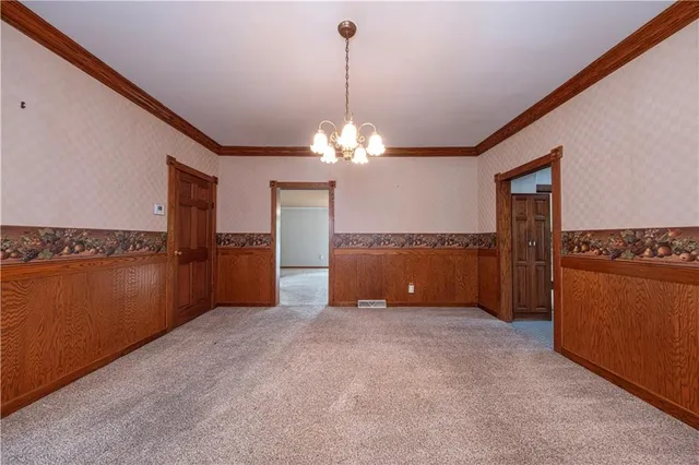 a view of a room window and kitchen view
