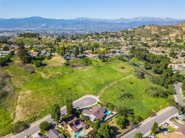 a view of a city with mountains in the background