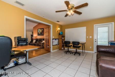 1930 Forbes Road St. Augustine, FL 32092 - Photo 13 of 24 a living room with furniture and a flat screen tv