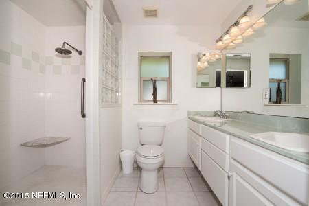 1930 Forbes Road St. Augustine, FL 32092 - Photo 15 of 24 a bathroom with a granite countertop sink mirror and toilet