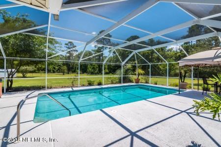 1930 Forbes Road St. Augustine, FL 32092 - Photo 19 of 24 a view of a backyard with swimming pool