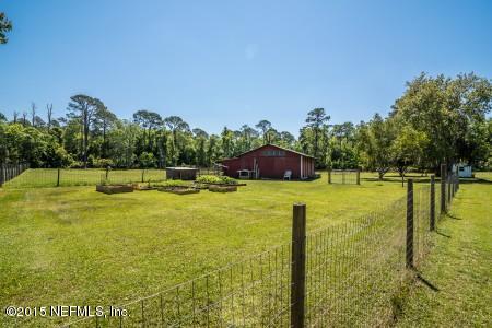 1930 Forbes Road St. Augustine, FL 32092 - Photo 24 of 24 a view of a swimming pool with a yard