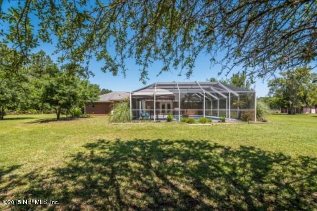 1930 Forbes Road St. Augustine, FL 32092 - Photo 5 of 24 a front view of a house with a yard