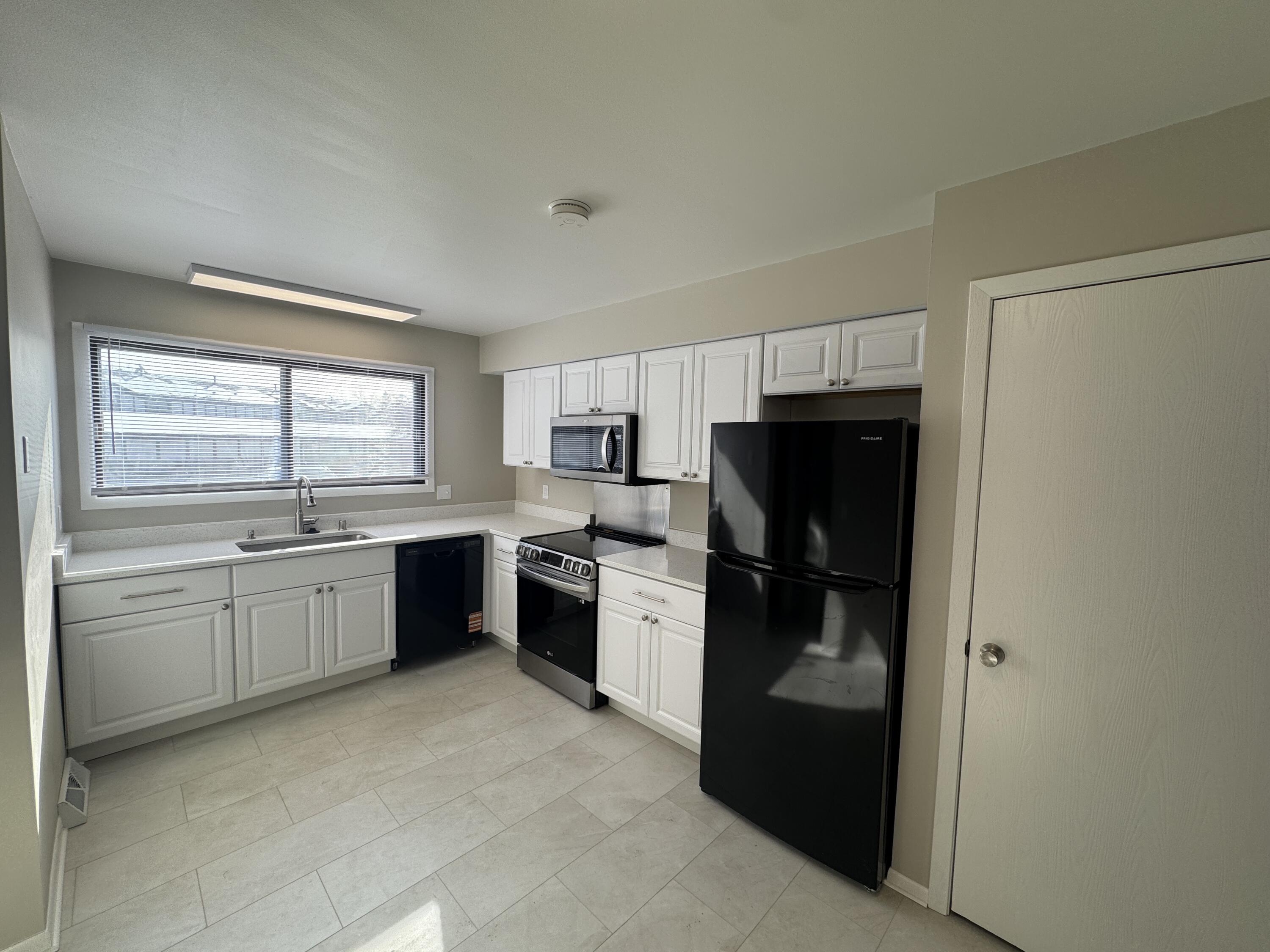 5742 Cambridge Circle, Unit 5 Mount Pleasant, WI 53406 - Photo 2 of 15 5742 Cambridge unit 5 kitchen angle 1