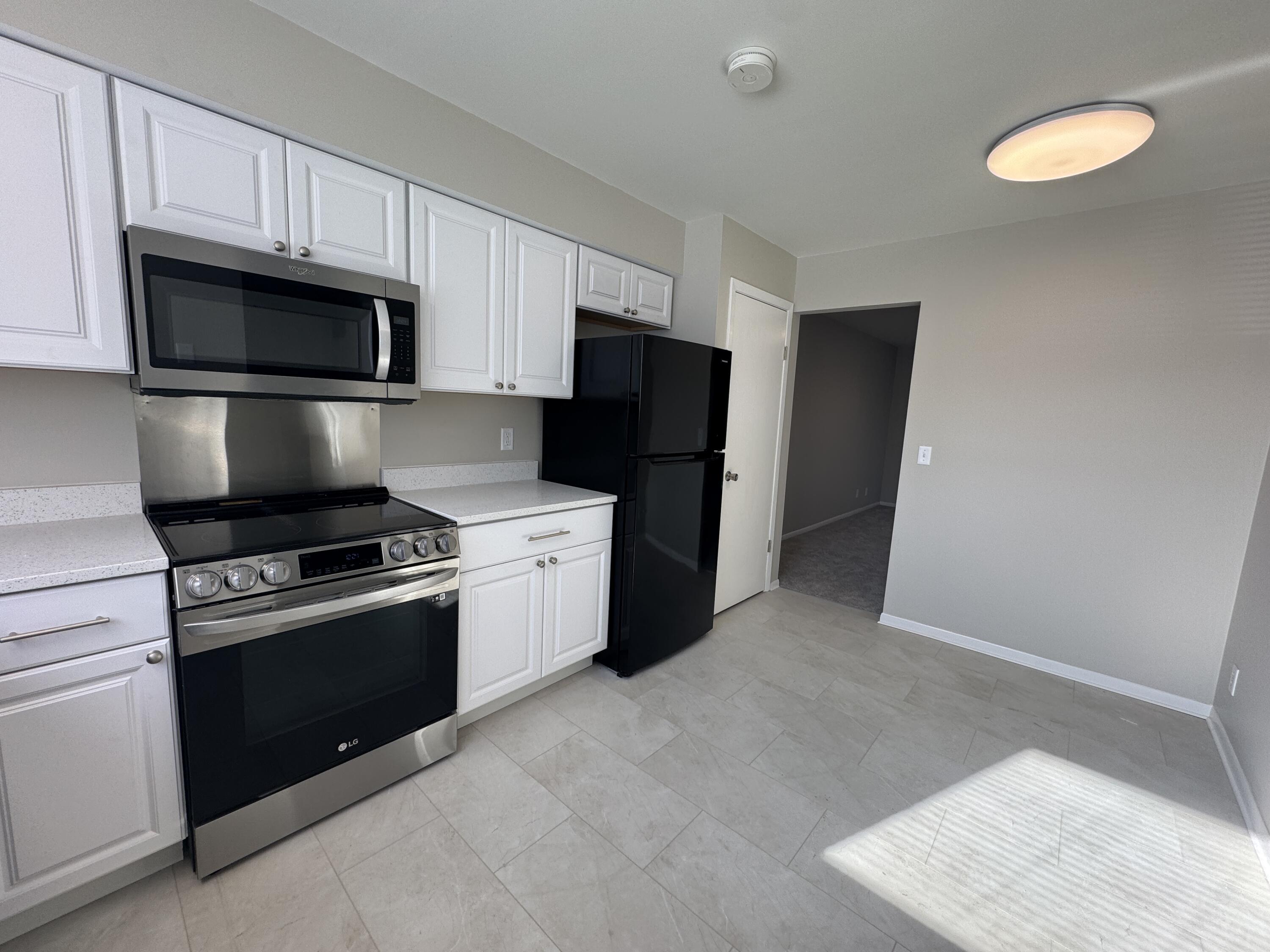 5742 Cambridge Circle, Unit 5 Mount Pleasant, WI 53406 - Photo 3 of 15 5742 Cambridge unit 5 kitchen angle 2