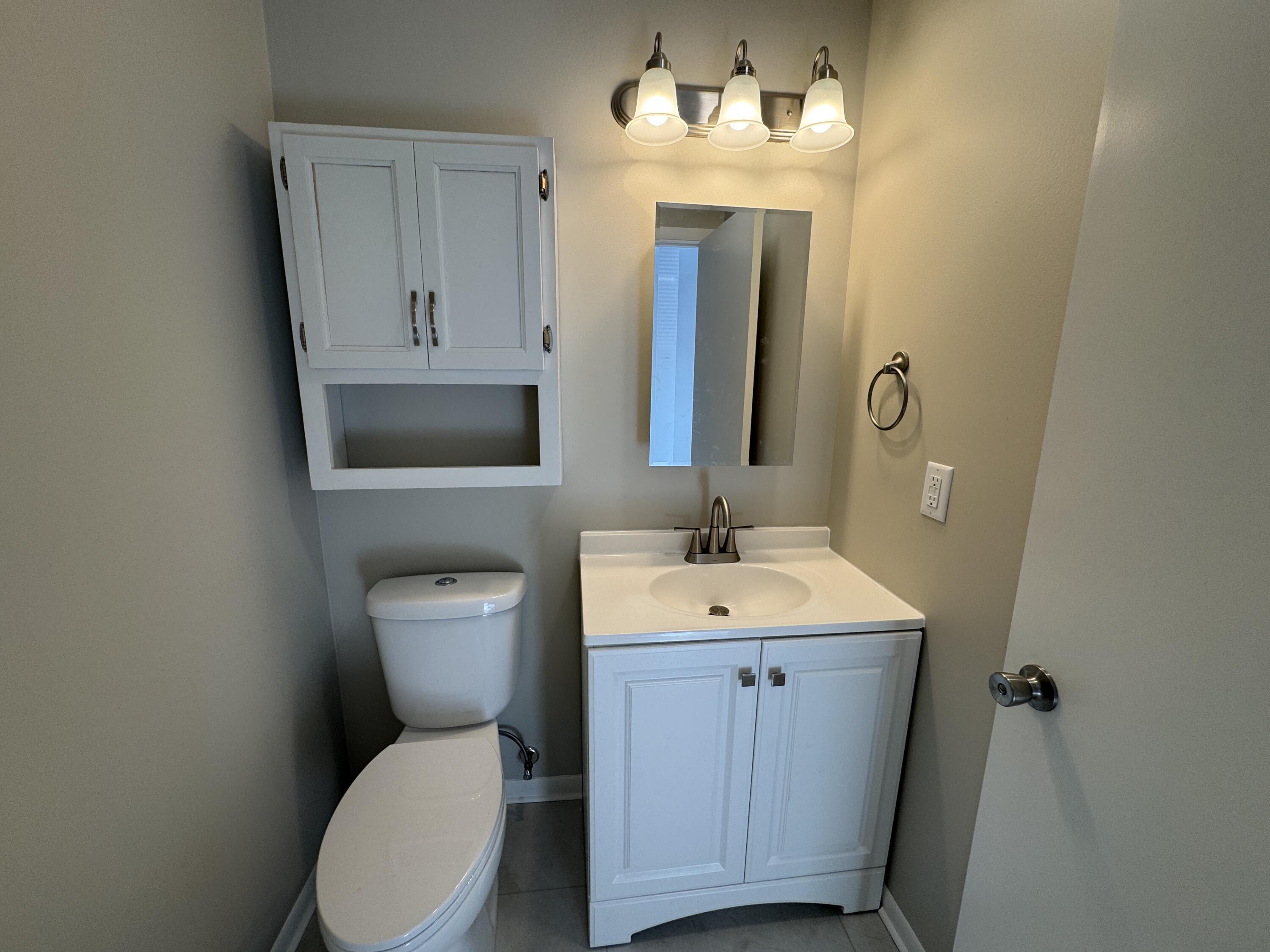 5742 Cambridge Circle, Unit 5 Mount Pleasant, WI 53406 - Photo 6 of 15 5742 Cambridge unit 5 half bath