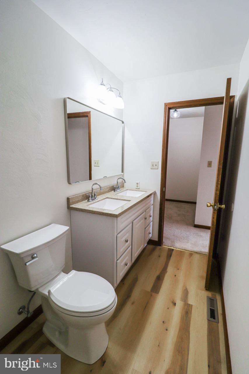 614 Eichelberger Street Hanover, PA 17331 - Photo 12 of 36 a bathroom with a sink a toilet and mirror