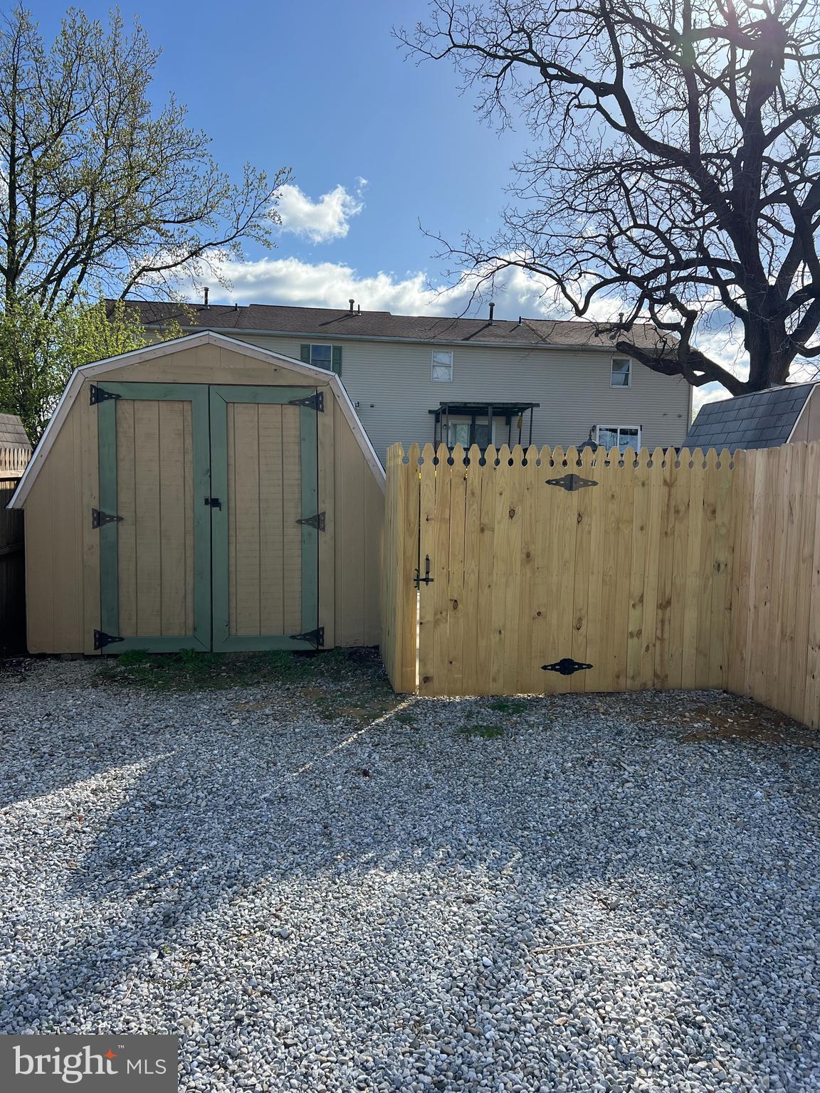 614 Eichelberger Street Hanover, PA 17331 - Photo 33 of 36 a view of a house with large trees and a wooden fence