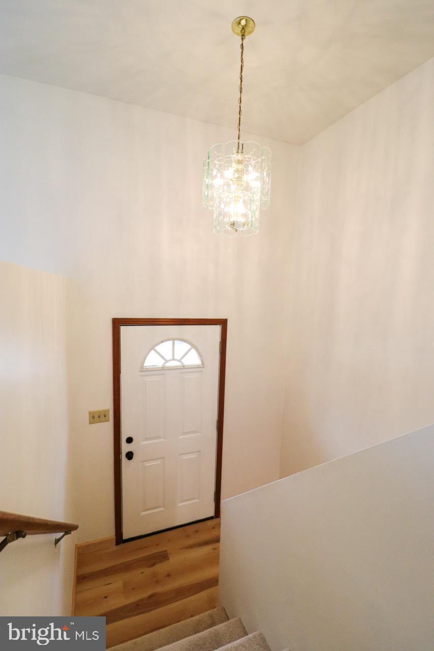 614 Eichelberger Street Hanover, PA 17331 - Photo 4 of 36 a view of a hallway with a chandelier fan