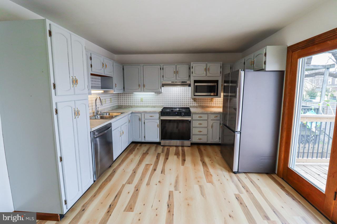 614 Eichelberger Street Hanover, PA 17331 - Photo 7 of 36 a kitchen with stainless steel appliances granite countertop a refrigerator and a stove top oven