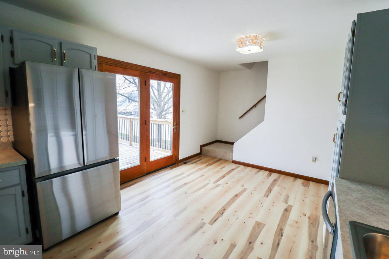 614 Eichelberger Street Hanover, PA 17331 - Photo 8 of 36 a view of an empty room with wooden floor and a window