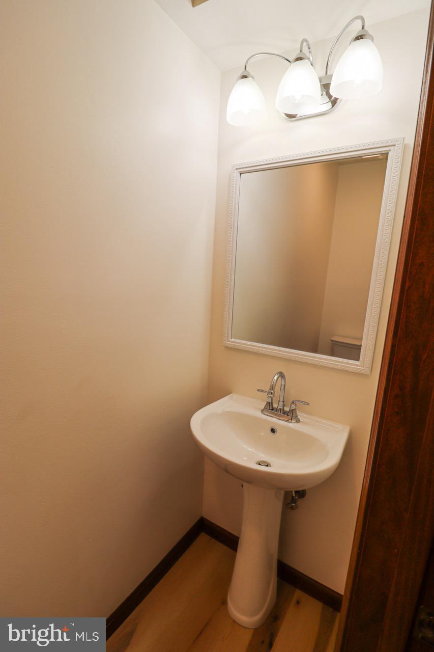 614 Eichelberger Street Hanover, PA 17331 - Photo 9 of 36 a bathroom with a sink and a mirror