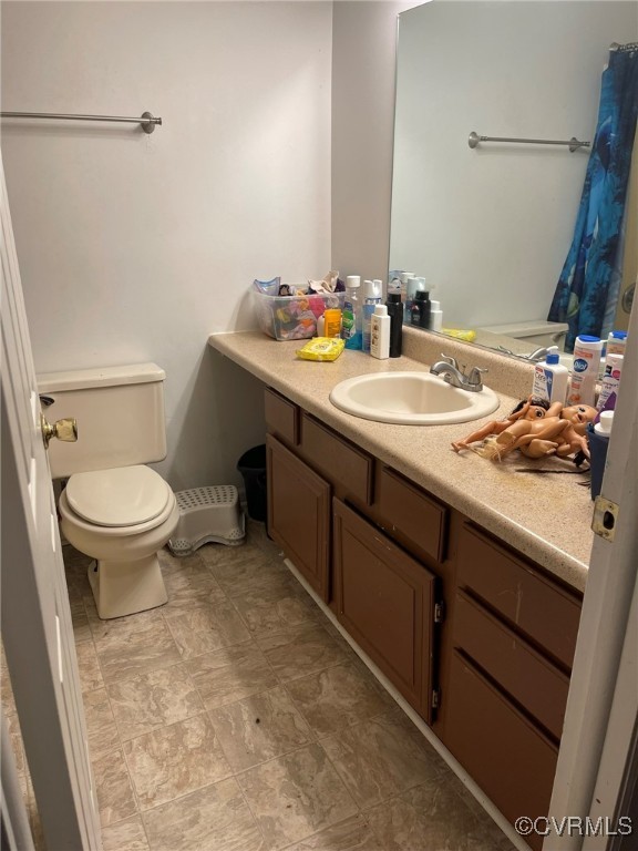 10131 Ridgerun Road Chesterfield, VA 23832 - Photo 9 of 18 a bathroom with a sink and a toilet