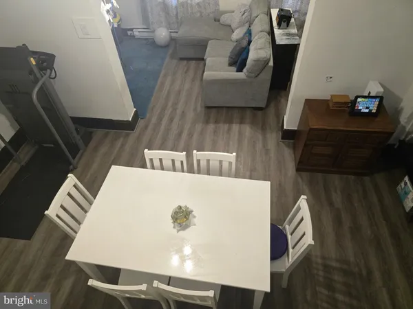 a kitchen view of a kitchen island wooden floor and a window