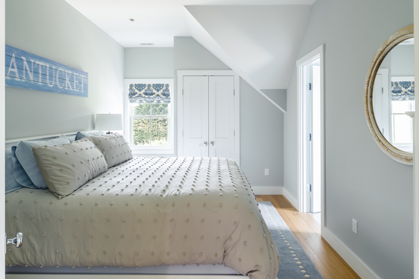 86 Cliff Road Nantucket, MA 02554 - Photo 18 of 29 a large bed sitting in a bedroom next to a window