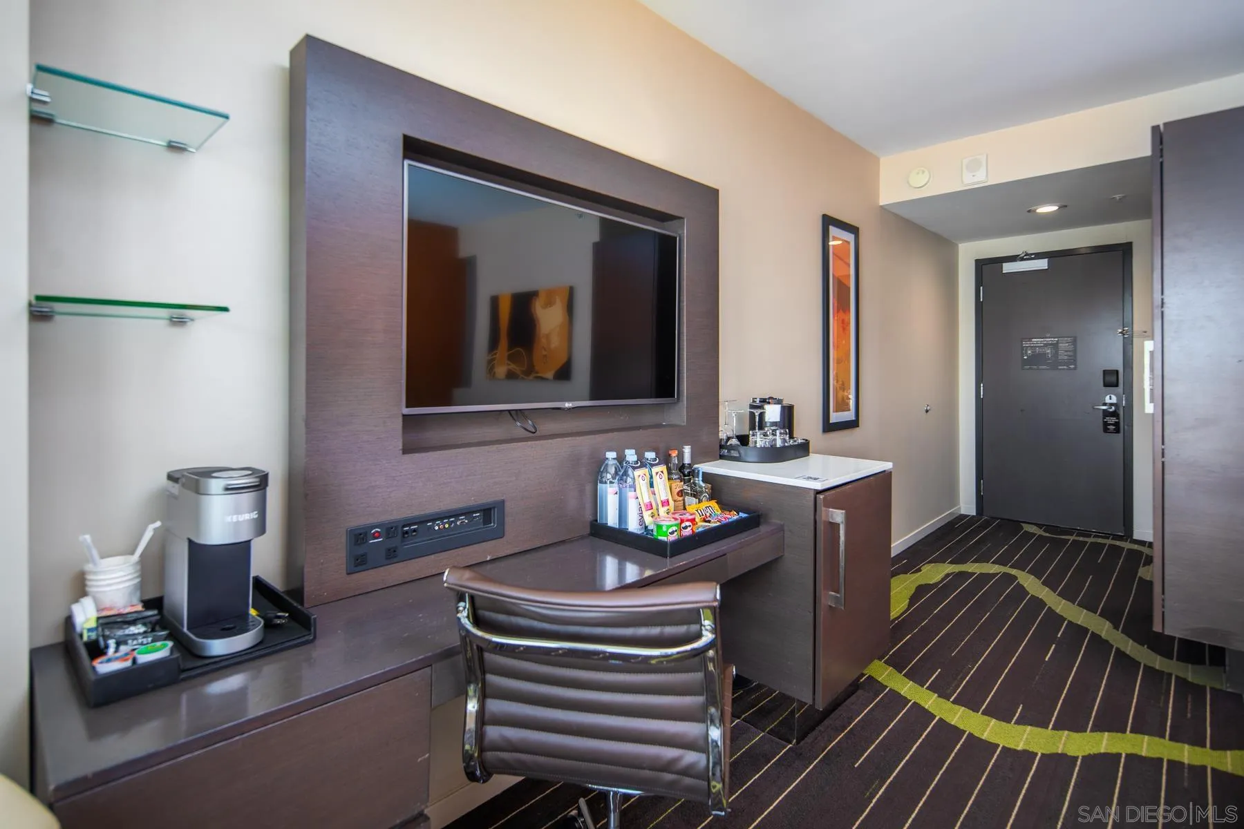 207 Fifth Avenue, Unit 1224 San Diego, CA 92101 - Photo 6 of 15 a bathroom with a sink a mirror and a bathtub