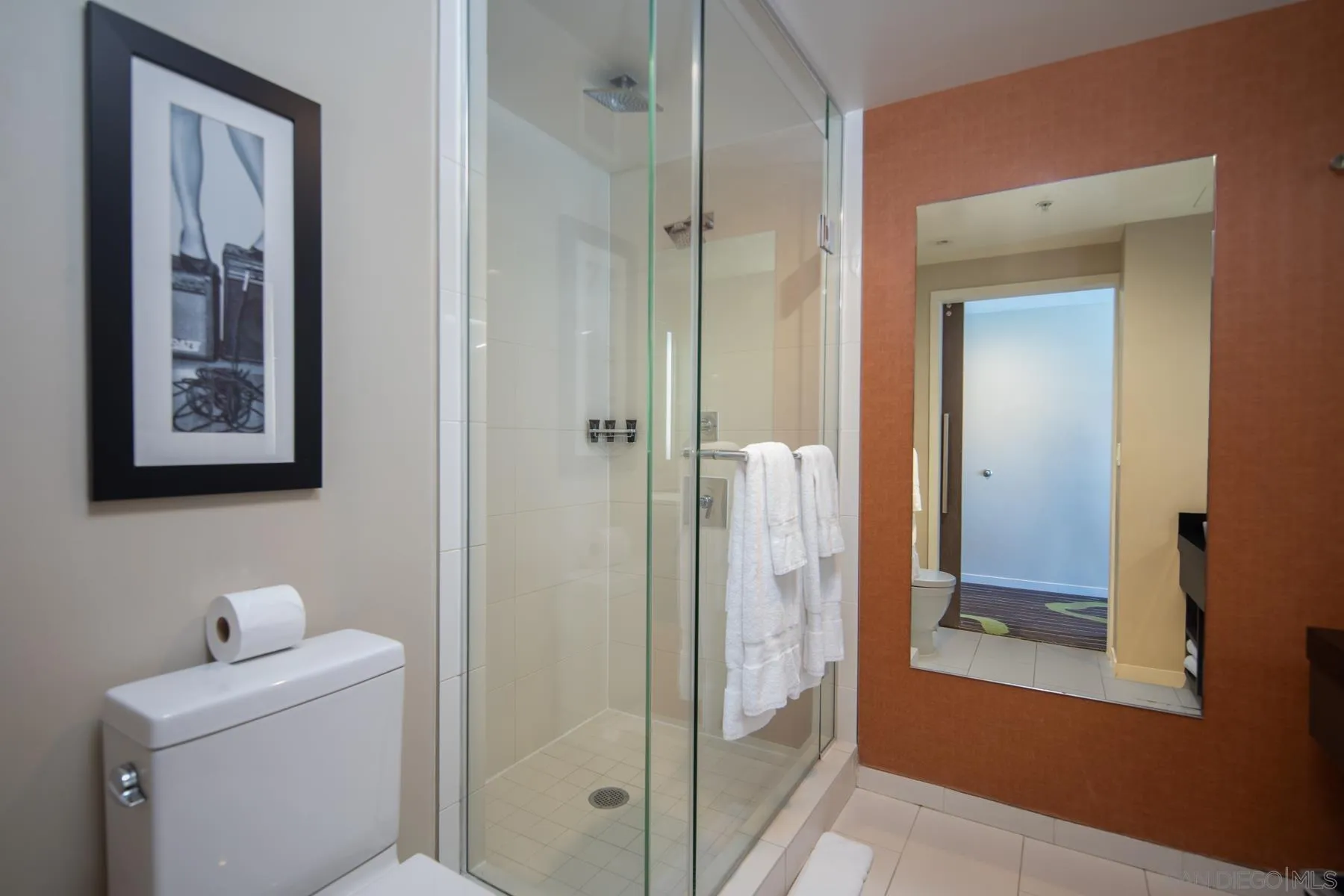 207 Fifth Avenue, Unit 1224 San Diego, CA 92101 - Photo 7 of 15 a bathroom with a shower and sink