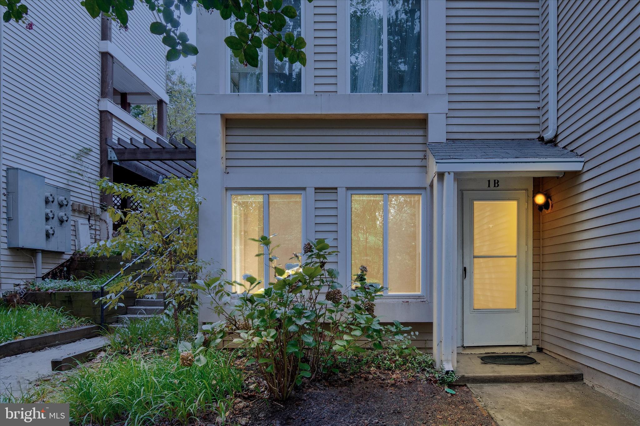 10310 Rein Commons Court, Unit 1B Burke, VA 22015 - Photo 1 of 23 a front view of a house