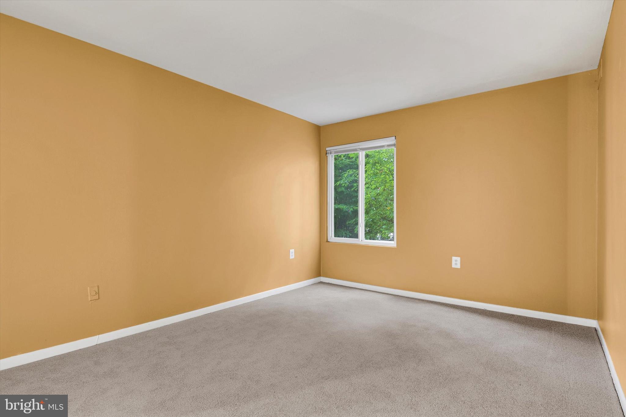 10310 Rein Commons Court, Unit 1B Burke, VA 22015 - Photo 15 of 23 an empty room with windows