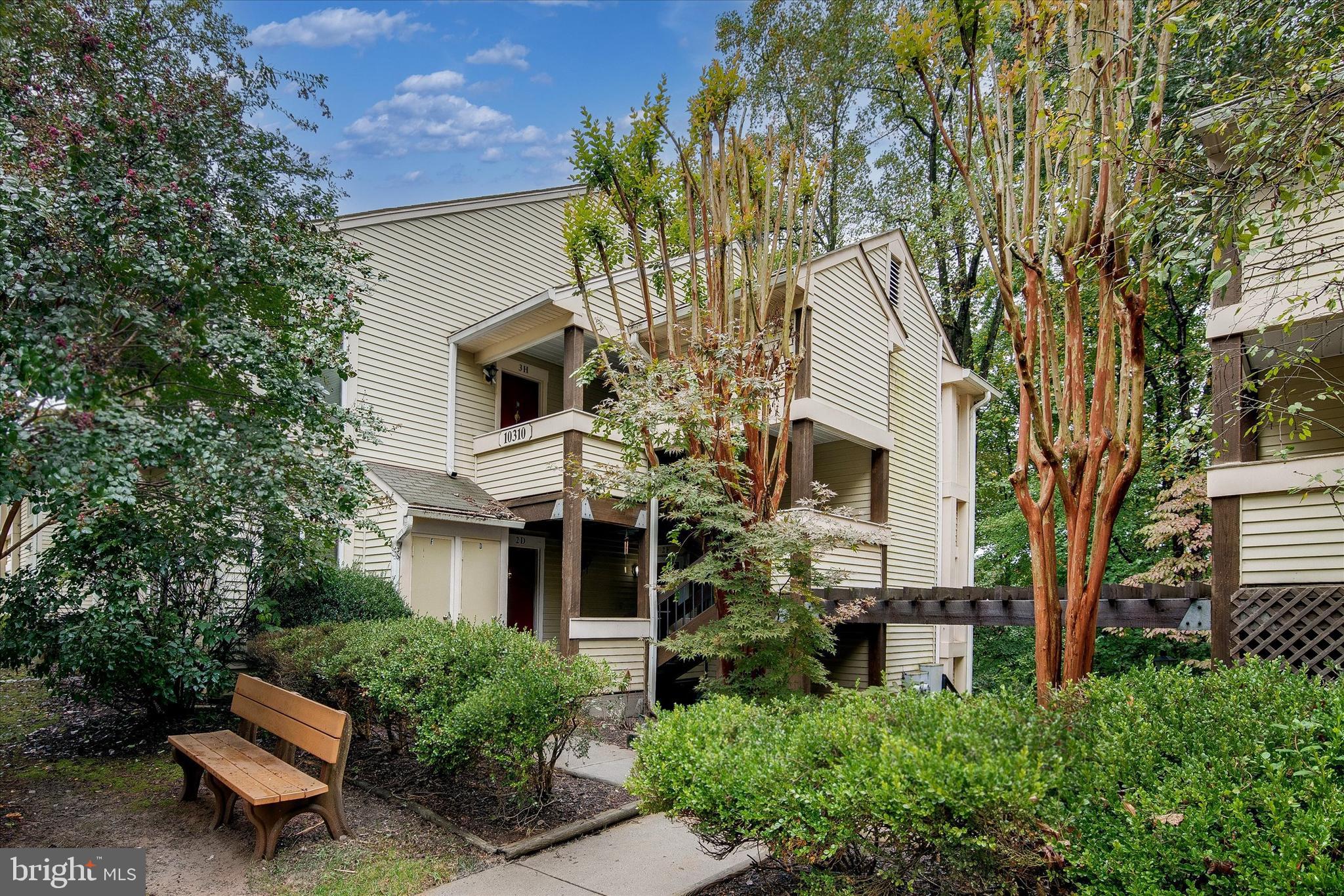 10310 Rein Commons Court, Unit 1B Burke, VA 22015 - Photo 4 of 23 a view of a house with a chairs in a patio