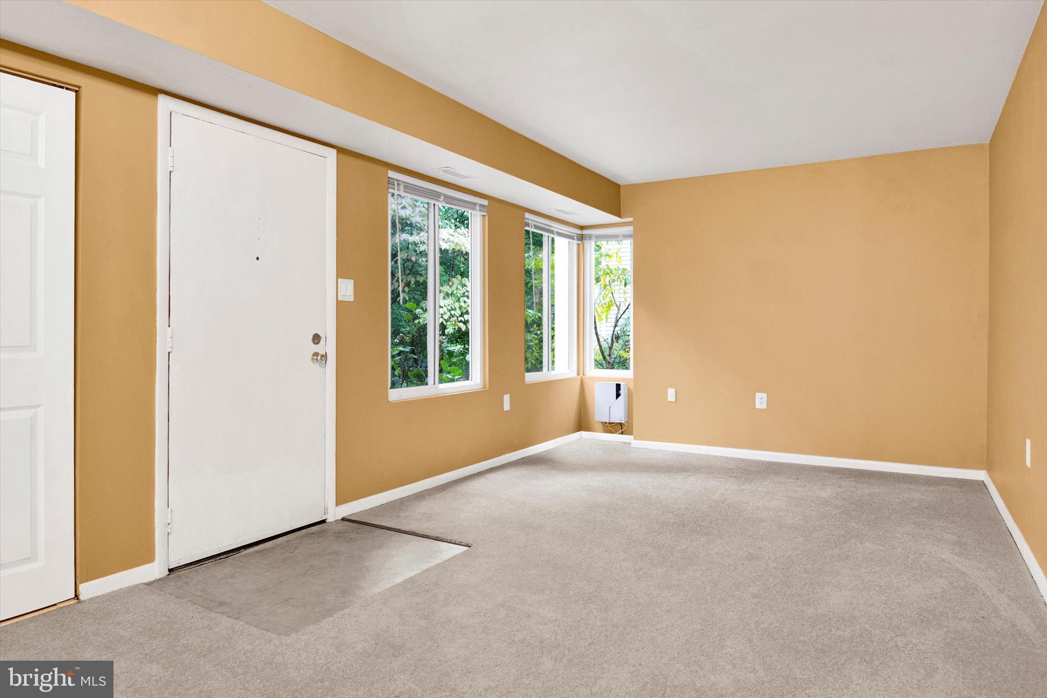 10310 Rein Commons Court, Unit 1B Burke, VA 22015 - Photo 9 of 23 a view of an empty room with a window